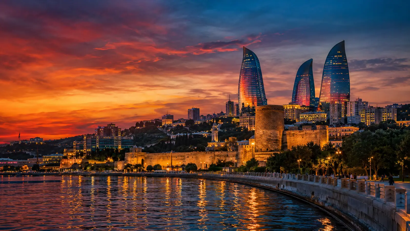 Baku visa from Pakistan: the Flame Towers glowing over Baku and the Caspian at dusk